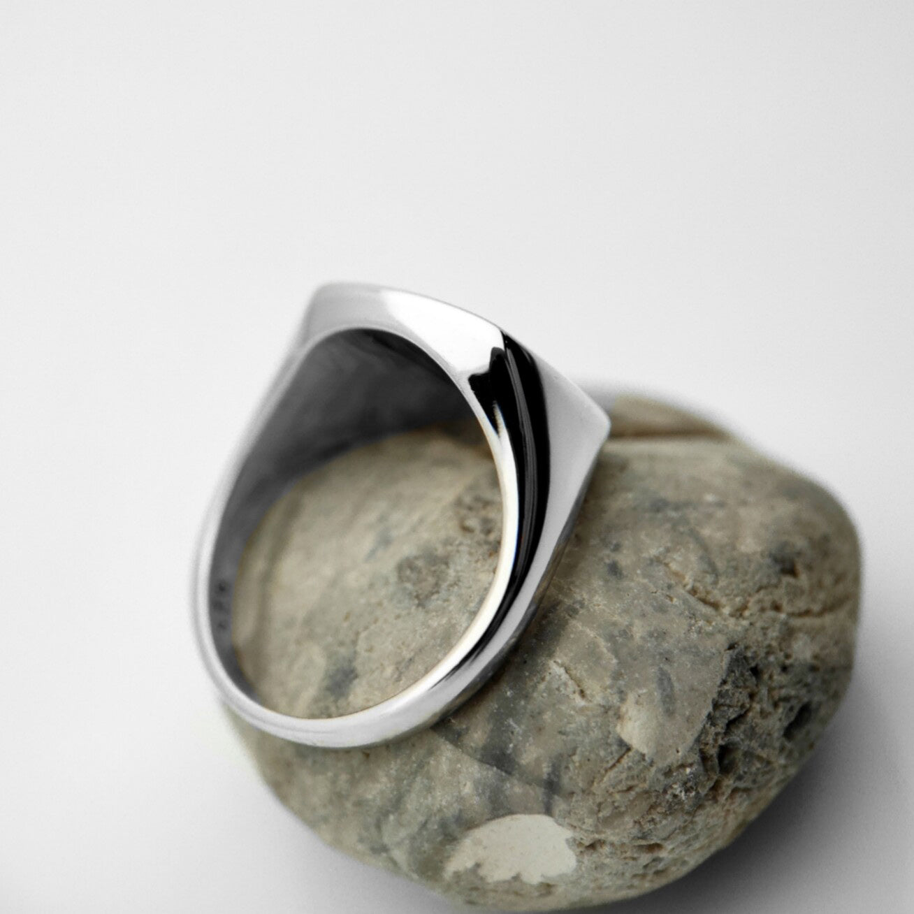 Sleek silver square signet ring with black accent, unisex handprint design