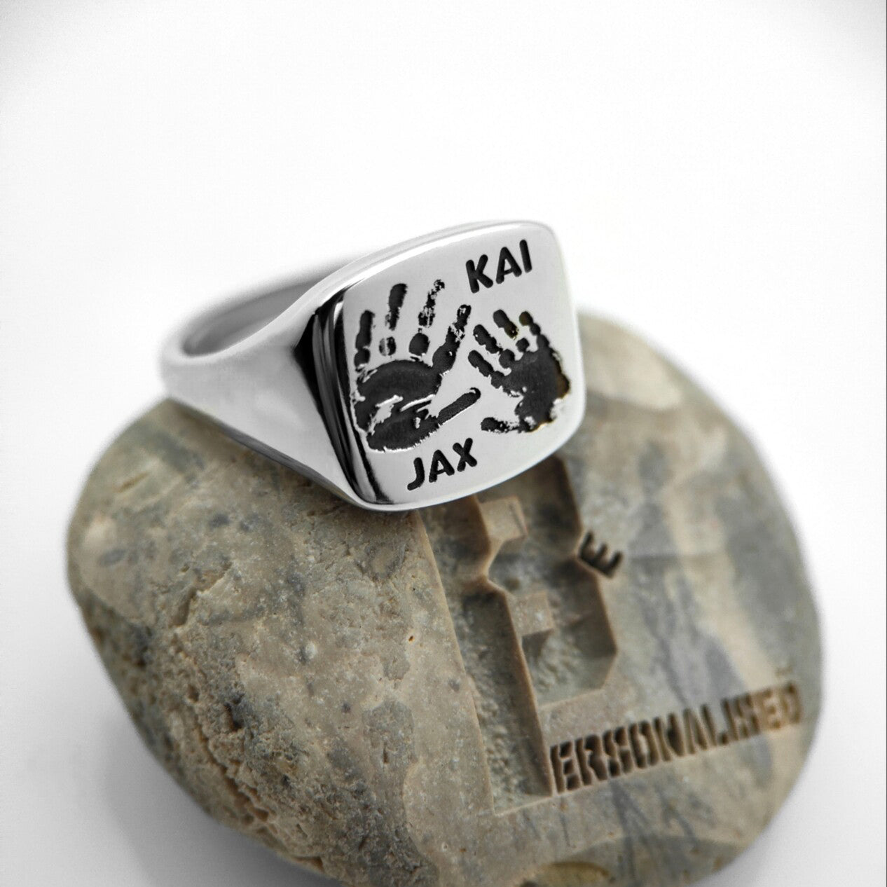 Silver signet ring back with engraved Kai and Jax handprints