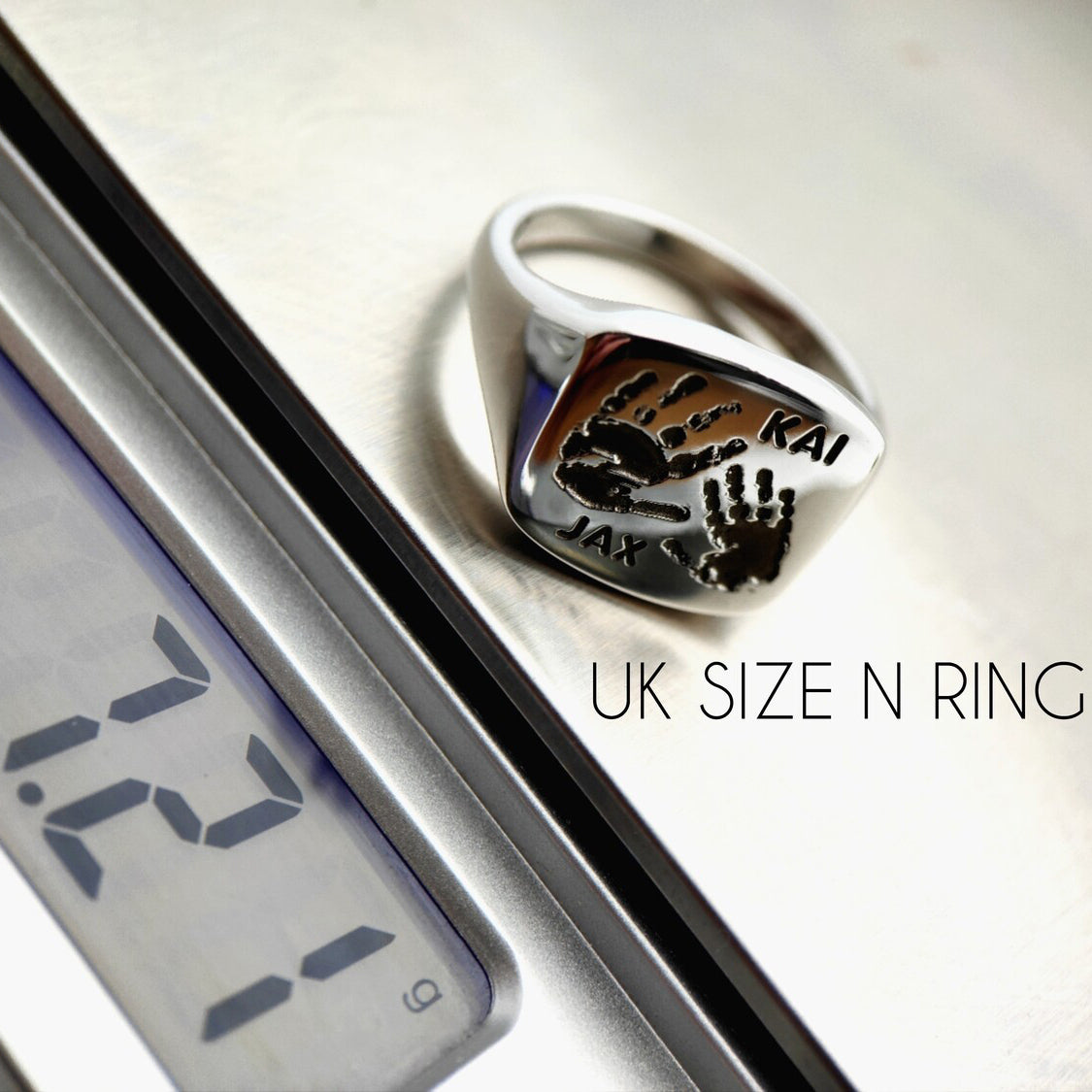 Silver signet ring back with engraved Kai and Jax handprints