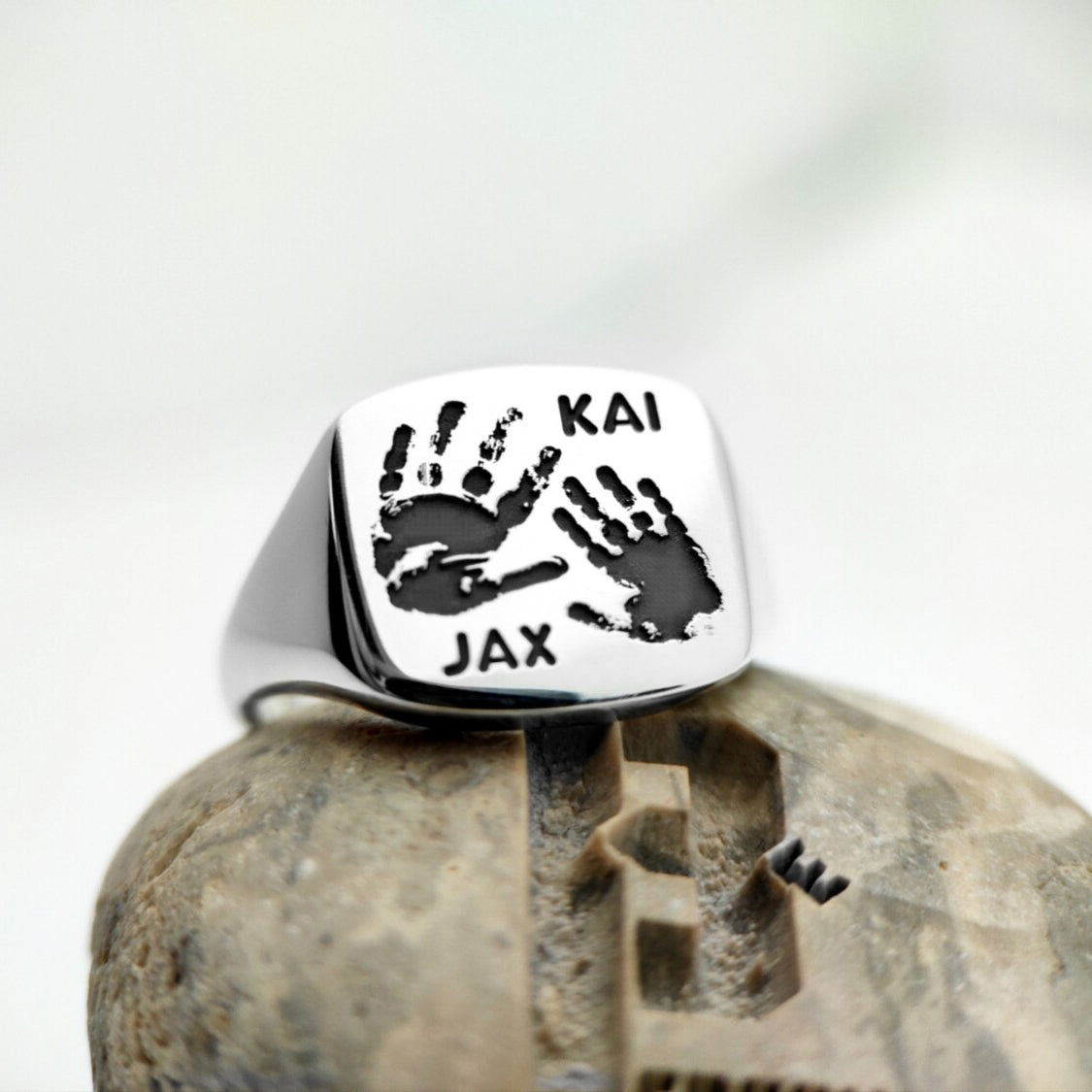 Silver signet ring back with engraved Kai and Jax handprints