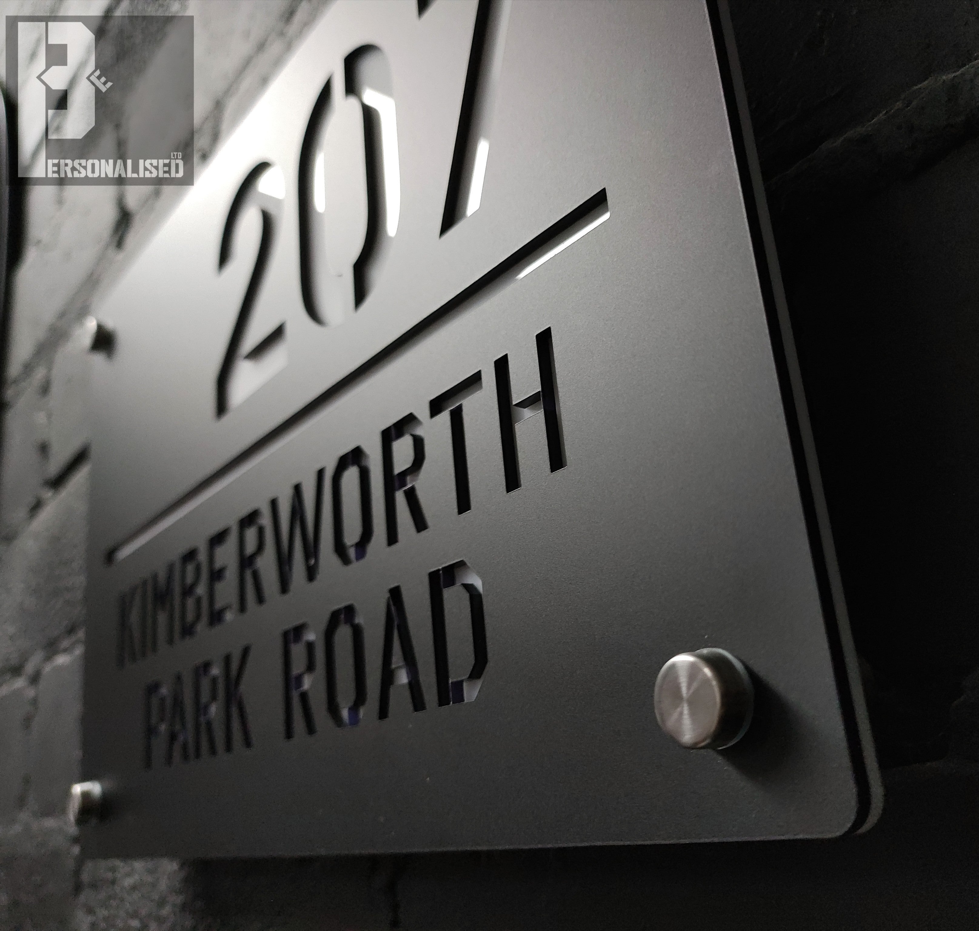 Sleek matte black house sign with 207 Kimberworth Park Road laser-cut letters