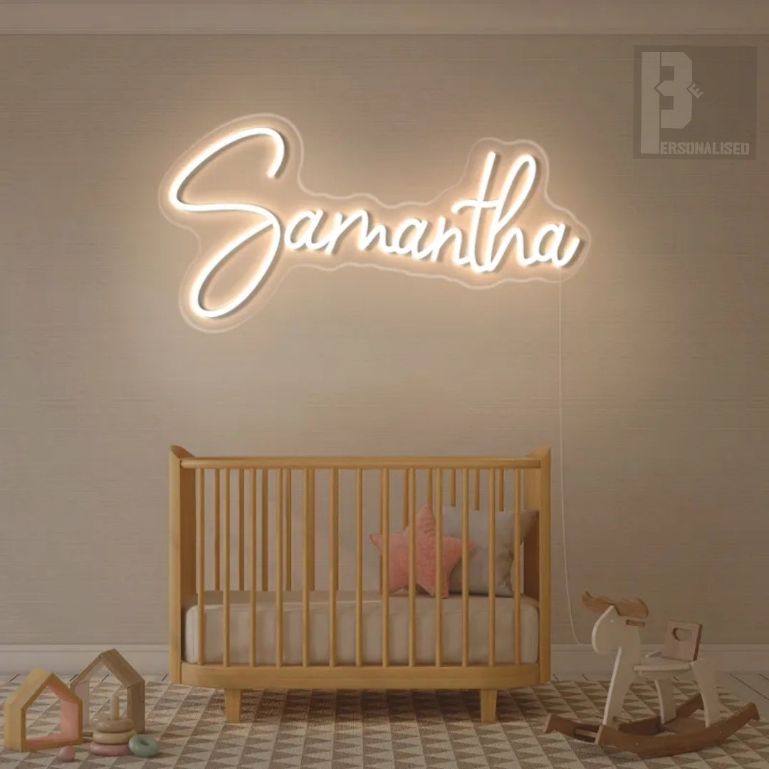 Glowing white neon Samantha sign in elegant cursive for kids bedroom decor
