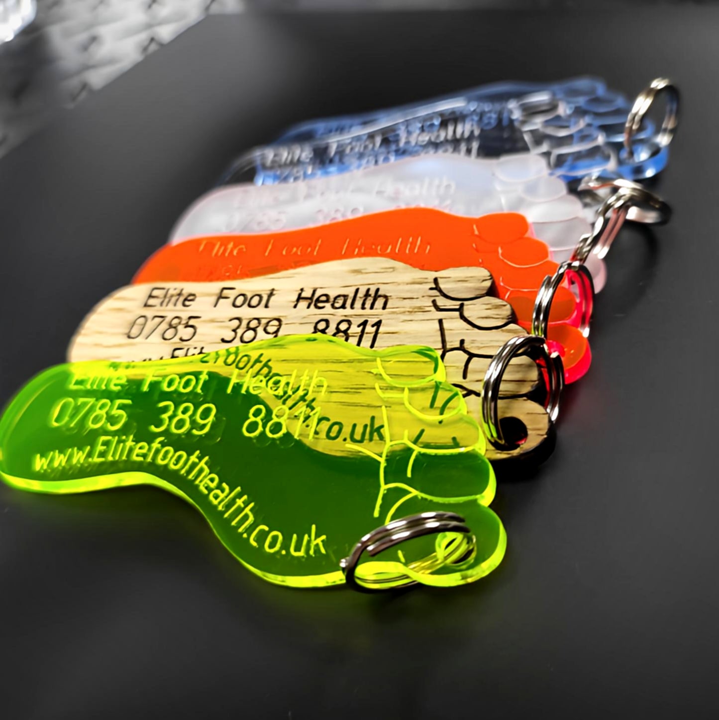 Translucent neon foot keychains engraved for elite foot health pros