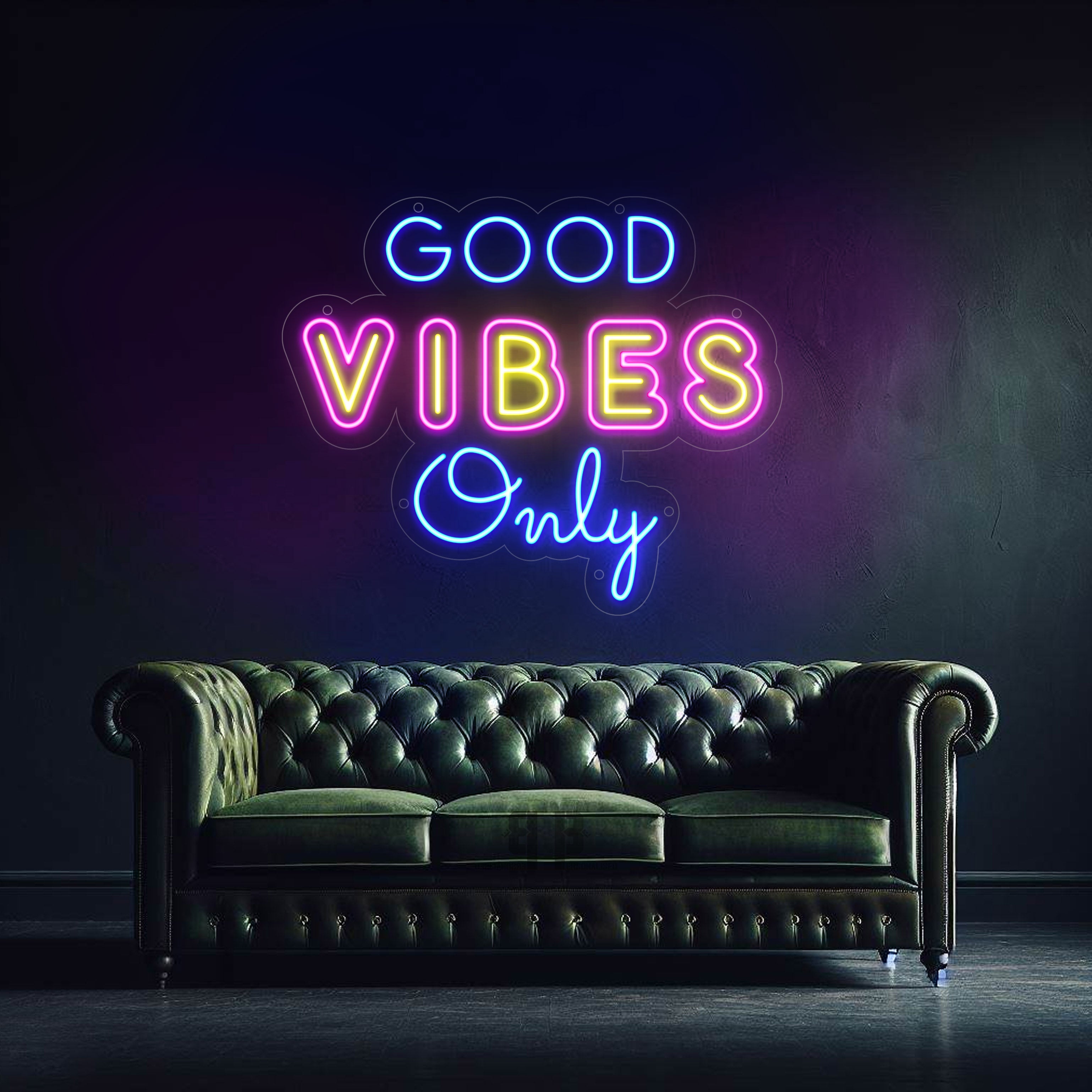 Dark green tufted leather Chesterfield sofa under Good Vibes Only neon sign