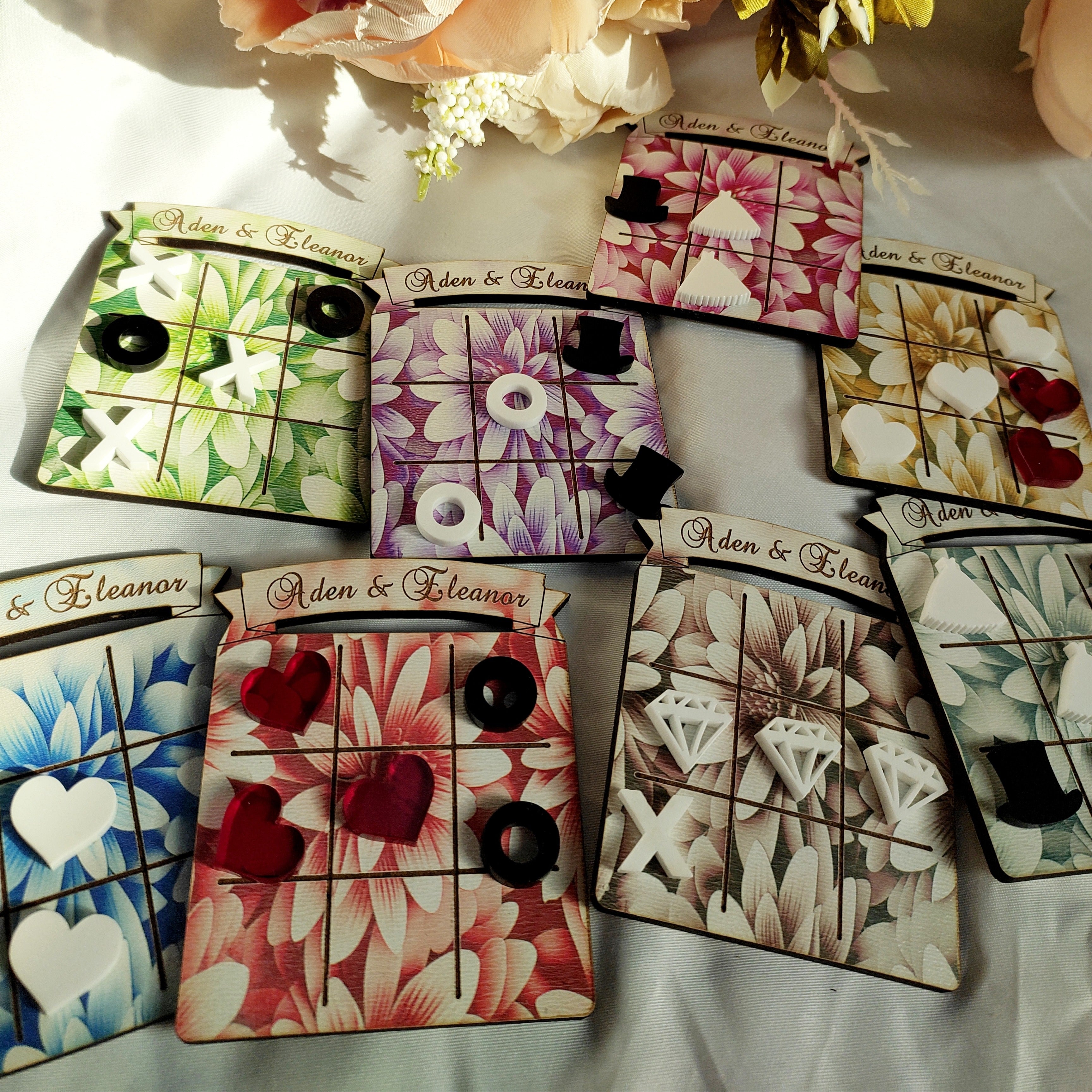 Colorful floral tic-tac-toe boards with decorative X and O pieces for Game On! wedding favors